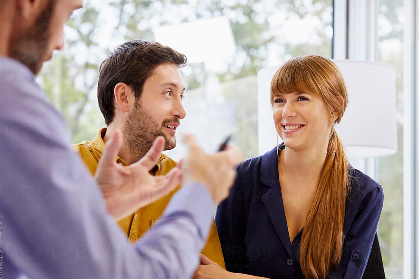 Group of adults talking and smiling