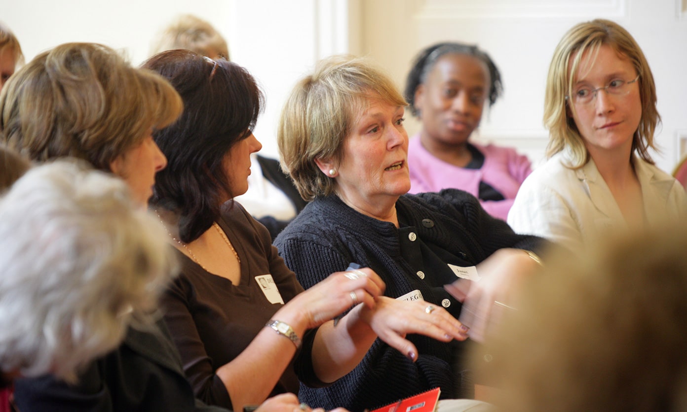 Group of adults in a workshops talking - human givens diploma